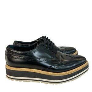Prada Black Brogue Leather Platform Low Top Sneakers